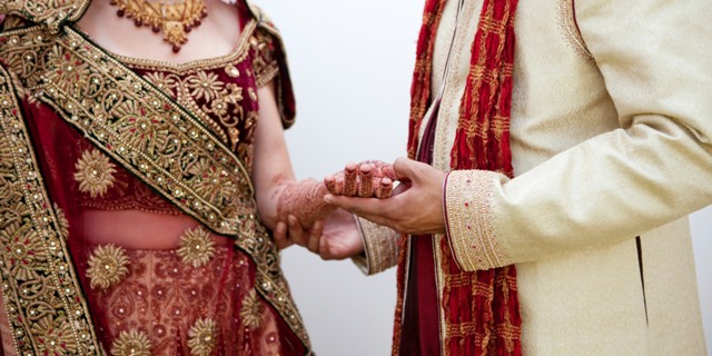 Bride and groom in traditional Indian wedding clothing